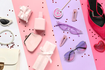 Composition with stylish female accessories and gifts on color background