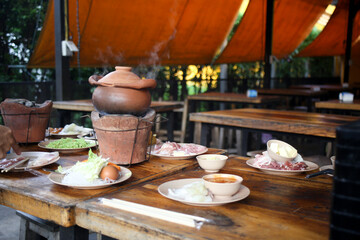  Jim Jum ,Thai Hot Pot with Clear Soup with Eggs, glass noodles, raw pork serve with Charcoal stove