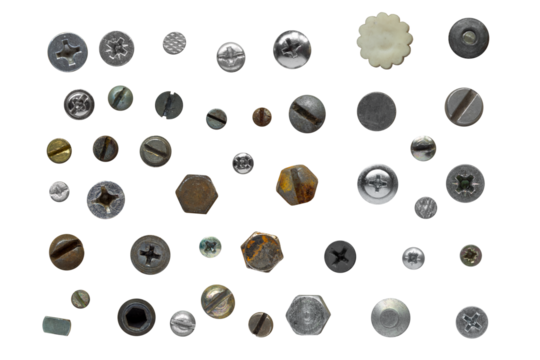 Assorted screws, nails and bolts collection top view. Overhead view of various screws and bolt heads isolated on a transparent background.