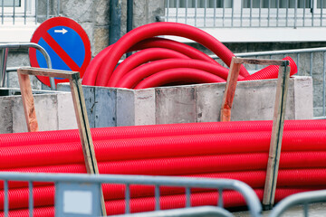 red corrugated pipes for  water or communications or sewer for install  in construction site on street city - 770022508