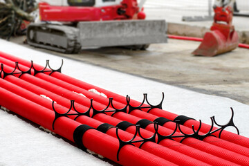 red corrugated pipes for  water or communications or sewer for install  in construction site on street city - 770022532