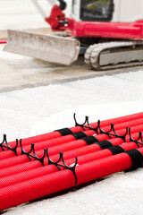 red corrugated pipes for  water or communications or sewer for install  in construction site on street city - 770022535