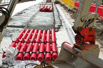 red corrugated pipes for  water or communications or sewer for install  in construction site on street city - 770022544