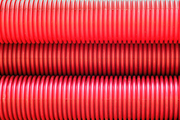 red corrugated pipes for  water or communications or sewer for install  in construction site on street city - 770022552