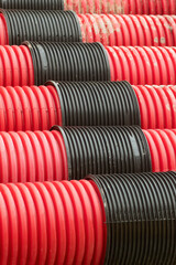 red corrugated pipes for  water or communications or sewer for install  in construction site on street city - 770022573