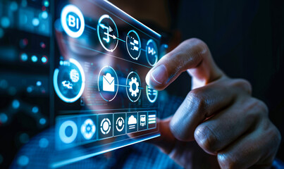 Obraz premium Business intelligence and data analytics concept - person touching virtual icons representing key BI tools and processes for gaining insights from corporate information to drive strategic decisions