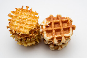 Belgian waffles isolated on white background, sugar waffles tasty dessert, appetizing and tasty