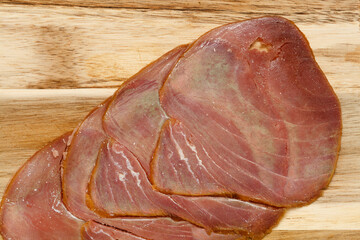 thin slices of Smoked tuna macro food background - 770024356