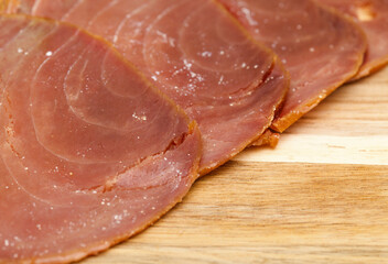 thin slices of Smoked tuna macro food background - 770024381