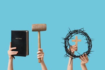 Female hands with crown of thorns, mallet and Holy Bible on color background. Good Friday concept