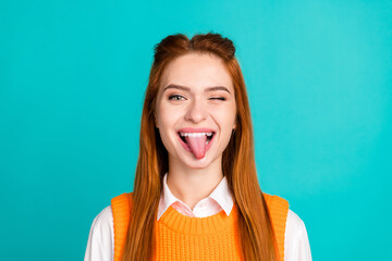 Photo portrait of pretty young girl tongue out naughty wear trendy orange knitwear outfit isolated...