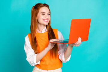 Photo of cute lovely woman wear stylish orange clothes modern technology hold wireless netbook...