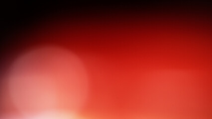One light spot on a red background in a black frame, an abstract blurry background. - 770029198