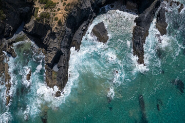 Portuguese coast of the Atlantic Ocean - underwater rocks - cliff - foamy turquoise ocean -bireye...