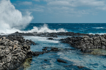 Makapuʻu Tide Pools, basalt comes from the Koʻolau volcano in eastern Oahu, Hawaii Geology. Waves...