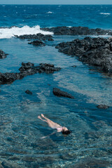 Makapuʻu Tide Pools, basalt comes from the Koʻolau volcano in eastern Oahu, Hawaii Geology. Waves hitting the rocks. 
