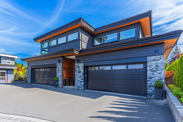 A large house with two garages and a driveway