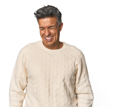 Middle-aged Latino man laughs and closes eyes, feels relaxed and happy. - Powered by Adobe
