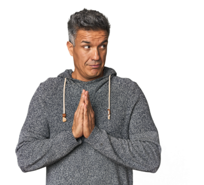 Middle-aged Latino man making up plan in mind, setting up an idea.