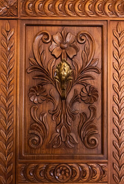 Pattern of flowers carved on wood, old wood carving
