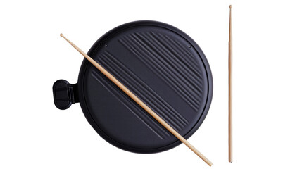 A pair of chopsticks resting on a black plate against a white backdrop
