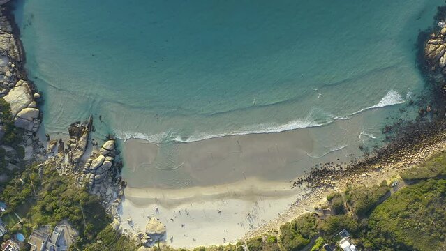 Drone of beach sand, ocean and waves for travel, tourism destination or tropical location in Cape Town. Aerial view of sea, blue water and nature or landscape for holiday in Llandudno, South Africa