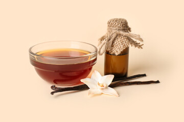 Composition with vanilla extract, sticks and flower on color background