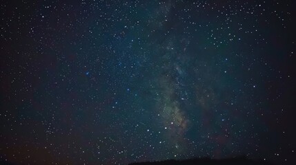 Starry Night Sky Over Silhouetted Horizon