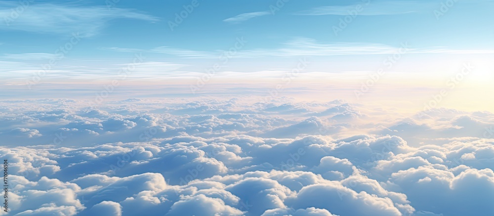 Wall mural the suns rays are breaking through the cumulus clouds in the sky, creating a beautiful atmospheric p