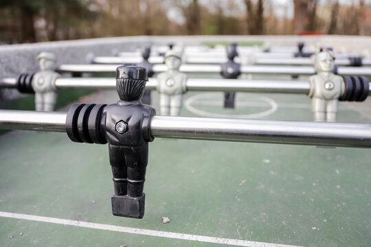 Foosball table. Conceptual image on the theme of one against many.