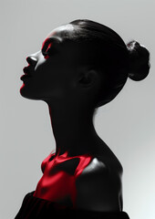 Beautiful black woman with red light on her face, fashion portrait, elegance