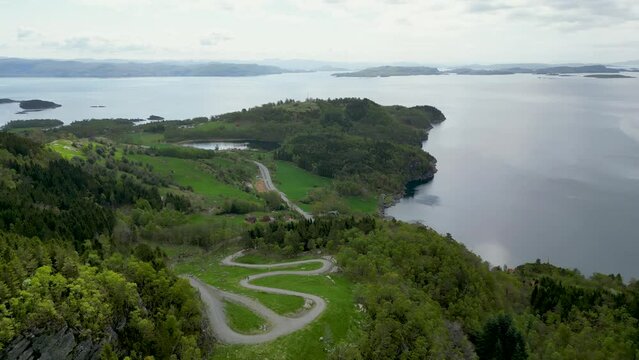 steep gravel path leading up to Himakona (The little Trolltunga) in Nedstrand, Norway, 4K drone.