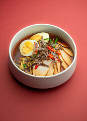 The restaurant serves bowls, sushi, and ramen, representing Pan-Asian cuisine