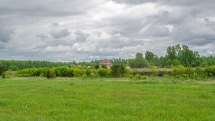 bright green field in cloudy weather