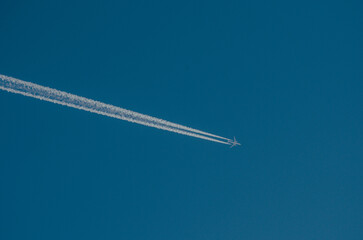 Sky, cloudless weather. An airplane trail in the sky
