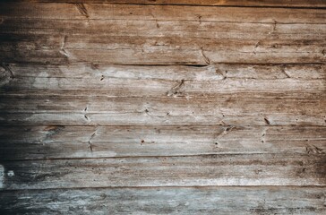 Brown wooden background. Wood texture. It's an aged logs wall. Rustic style. Weathered board....