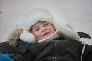 Snowy Adventures, A Young Boy Embracing Winter in Stylish Coat and Hat