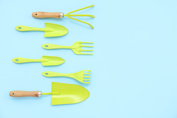 Gardening tools on blue background