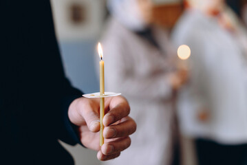 hand with church candle