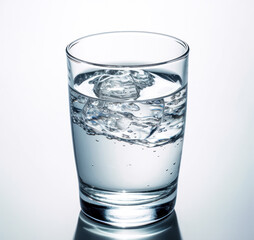 A crystal-clear glass showcases refreshing water adorned with glistening ice cubes, offering a cool and invigorating drink. Perfect for hydration concepts and beverage-related designs.