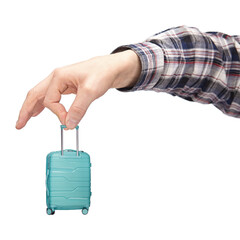 luggage and hand luggage, a miniature mint-colored suitcase on a white isolated background in the...