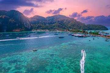 Taxi long tail boat to Phi Phi island, Krabi Province, Thailand sunset Aerial top view. Travel Thai...
