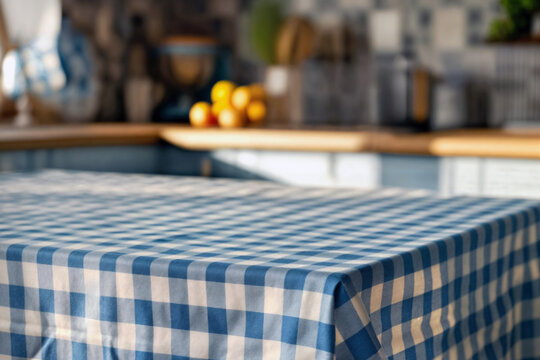 Cozy kitchen interior with a focus on a blue and white checkered tablecloth on a table, blurred background with wooden countertops and fresh fruit. High quality photo