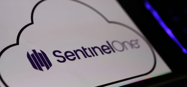 Viersen, Germany - March 9. 2024: Closeup of smartphone on computer keyboard with logo lettering of SentinelOne cyberscurity software company cloud