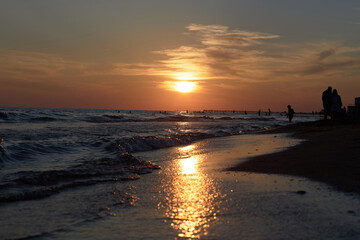 Suns Embrace: Ocean Sunset on Beach