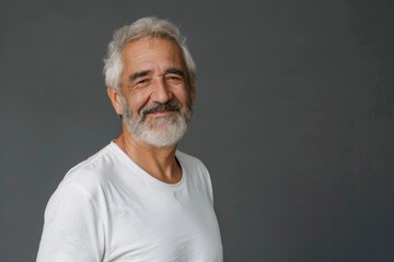 Portrait of a handsome senior man with grey hair and a beard