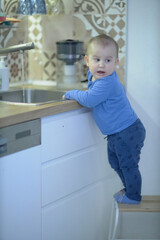 Little Boy Standing on Kitchen Counter