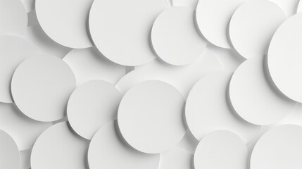Overlapping white plates create depth on a white background. Serene composition of white circles in layered design.
