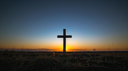 A powerful photograph of a cross silhouetted against a clear blue sky, conveying the significance of the cross in the Christian faith and the promise of redemption
