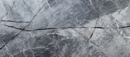 Close-up view of a marble slab showing intricate network of cracks and splits on the surface